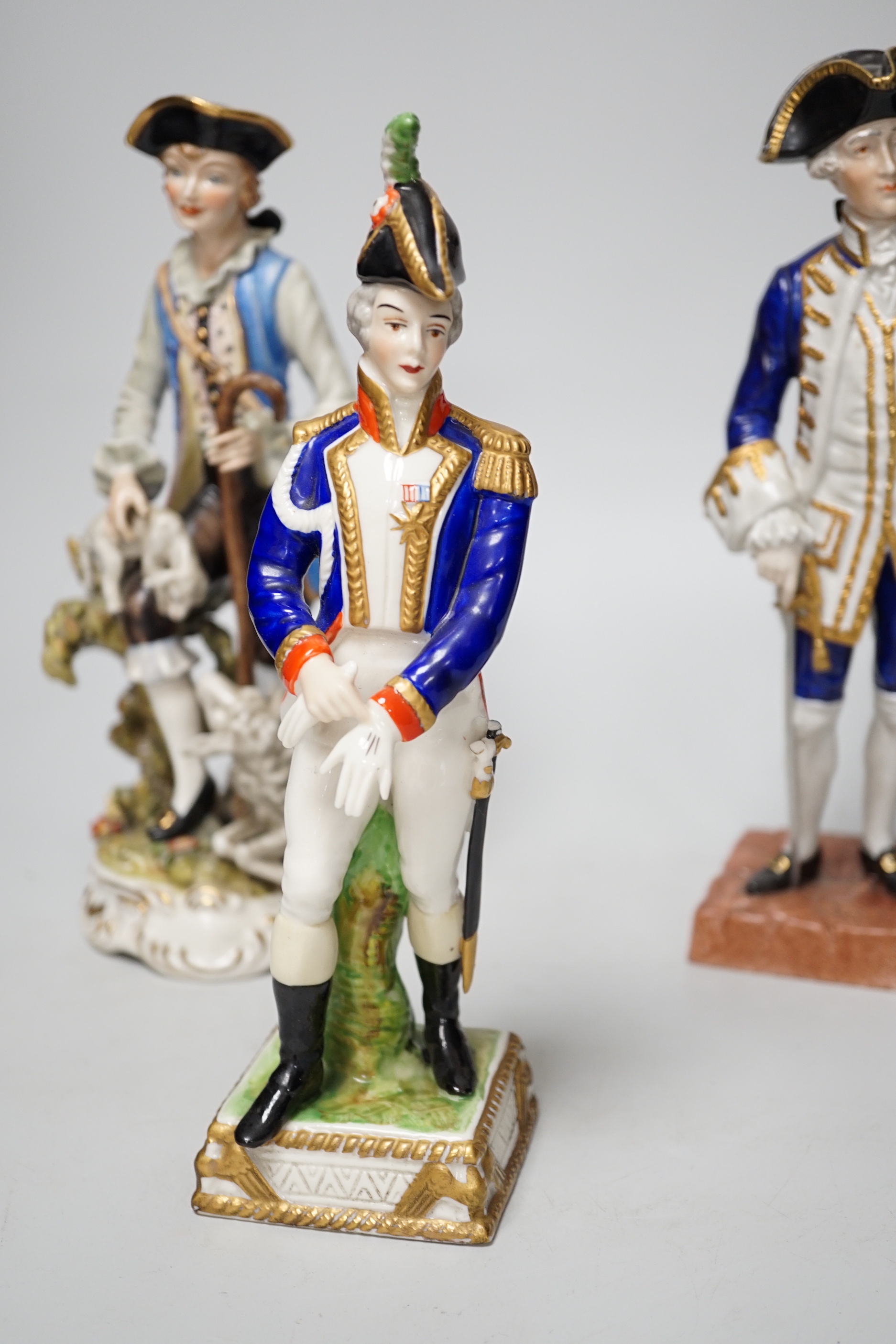 Two Dresden figure groups comprising a Shepherd and Admiral, together with one other, the largest 26cm high (3)